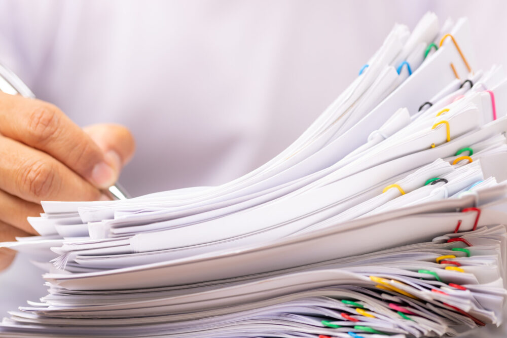 Man in a white shirt sign contract agreement documents in Stack